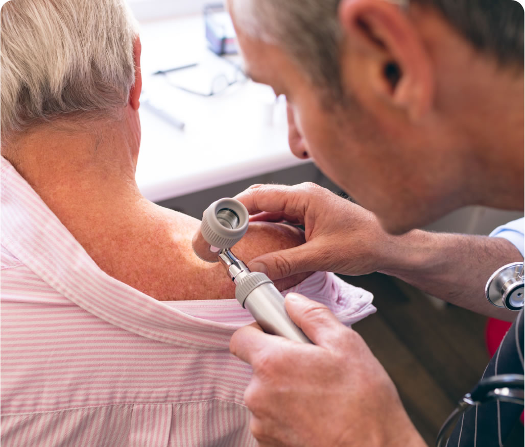 Dermatologist examines patient